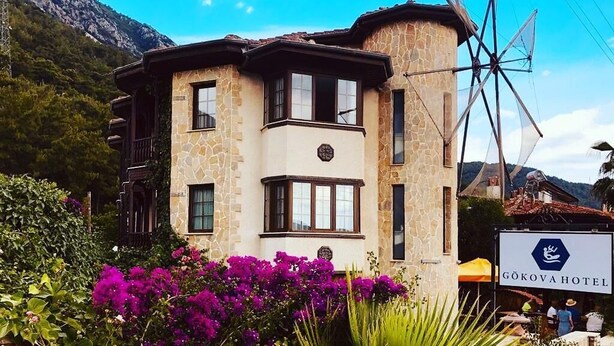 A stone building with a sign for Gökova Hotel. - Gokova Hotel (Ula)