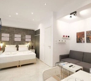 Apartment | Living area | TV - Wonderful Renovated Studio In Thisio (Athens)