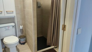 Combined shower/tub, hair dryer, towels, soap