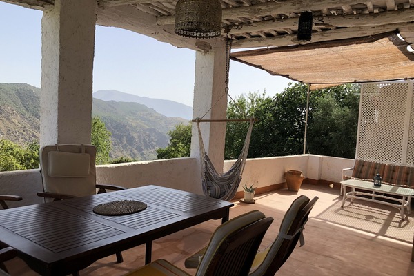 Terrace , sofa area at the end, dining area at the front of photo.