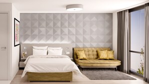 A modern bedroom with a bed, bedside table, and a sofa. - Lusso (Macclesfield)