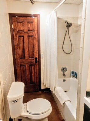 Combined shower/tub, hair dryer, towels, soap
