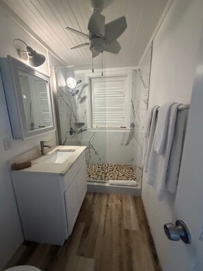 Shower, hair dryer, towels, soap