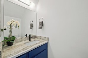 Combined shower/bathtub, towels, soap, toilet paper