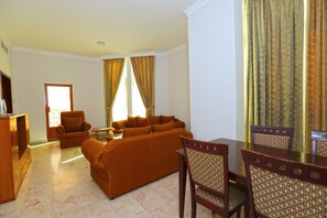 Apartment, 1 Bedroom | Living room | 32-inch flat-screen TV with satellite channels, TV