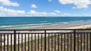 A beach view from a balcony with a railing, ocean, and clear sky. - Sea Gull #907: Beachfront 2 Bedroom 2 Bathroom With Spectacular Views and 24 Hour Management (Port Aransas)