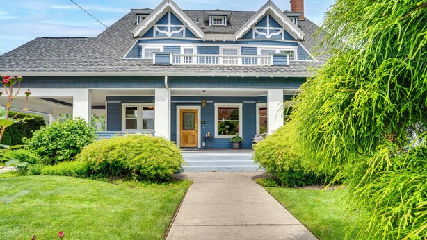 A two-story house with a front porch, a small garden, and a clear pathway leading to the entrance. - Wine Country Home with Yard; Walk to Downtown! (Walla Walla)