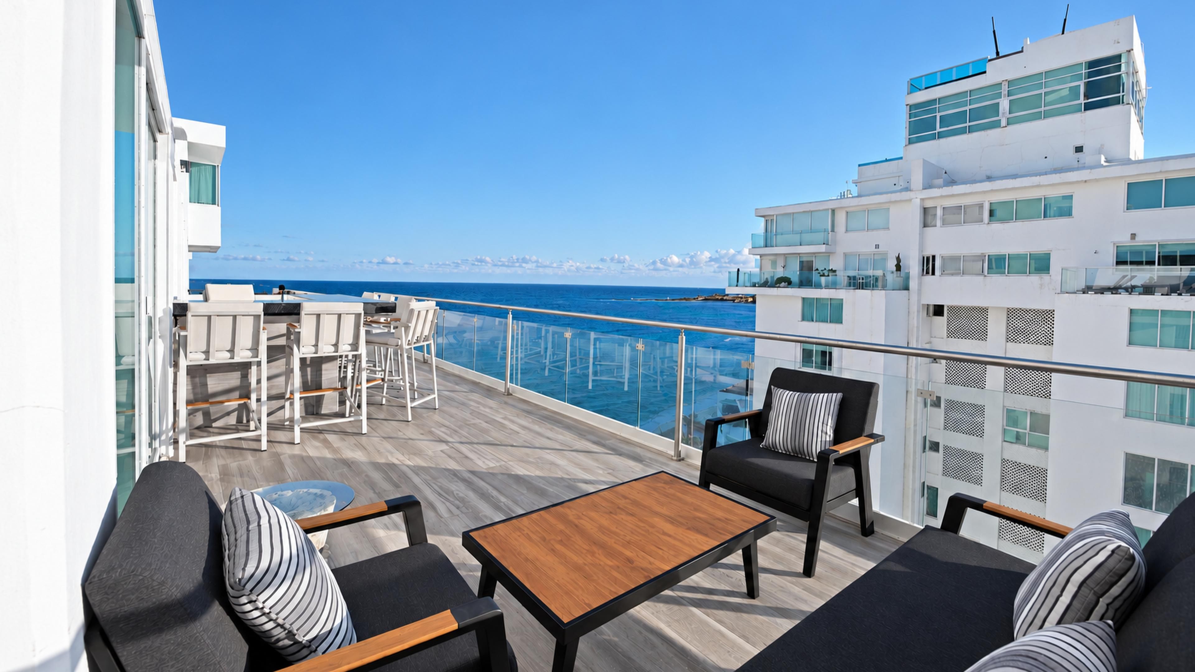 Large terrace with a Caribbean-view and a lagoon view at Penthouse 3704, a Cancun vacation rental by Tim’s Ocean Condos.