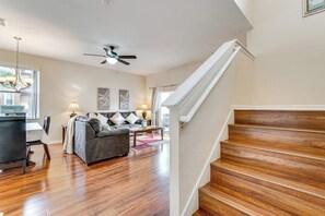 A staircase with wooden steps leading to a landing.