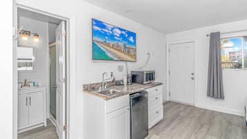 Standard Studio, 1 King Bed, Kitchenette | Private kitchenette | Fridge, stovetop, dishwasher, coffee/tea maker