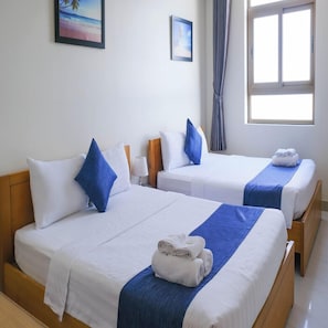 Chambre Triple Deluxe | Minibar, rideaux occultants, chambres insonorisées, Wi-Fi gratuit