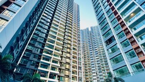 A high-rise residential building with multiple balconies and a swimming pool area. - R&F PRINCESS COVE BY HOMEFORT SUITES (Johor Bahru)