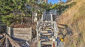 A wooden staircase leading uphill, surrounded by trees and vegetation. - Studio with a View!! (Friday Harbor)
