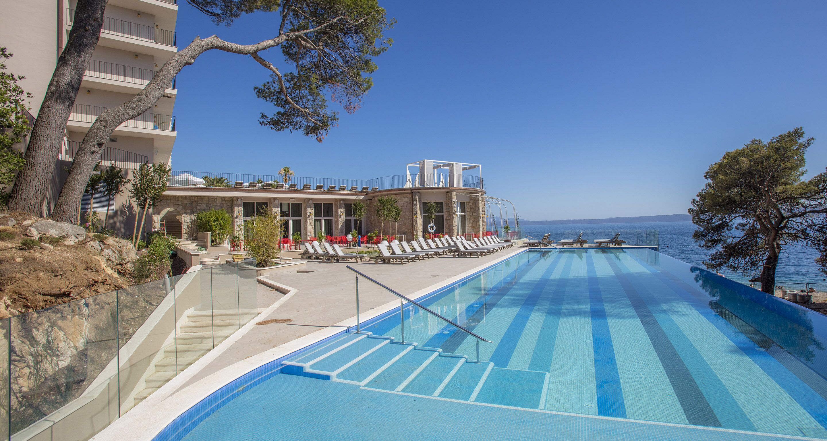 seasonal outdoor pool, pool umbrellas, pool loungers