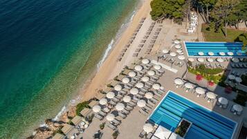 On the beach, beach cabanas, sun-loungers, beach umbrellas