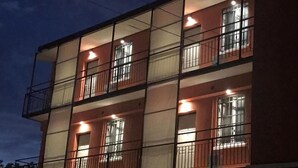 A multi-story building with balconies and windows, featuring a simple architectural design. - GARBINI AT FAIR A (Verona)