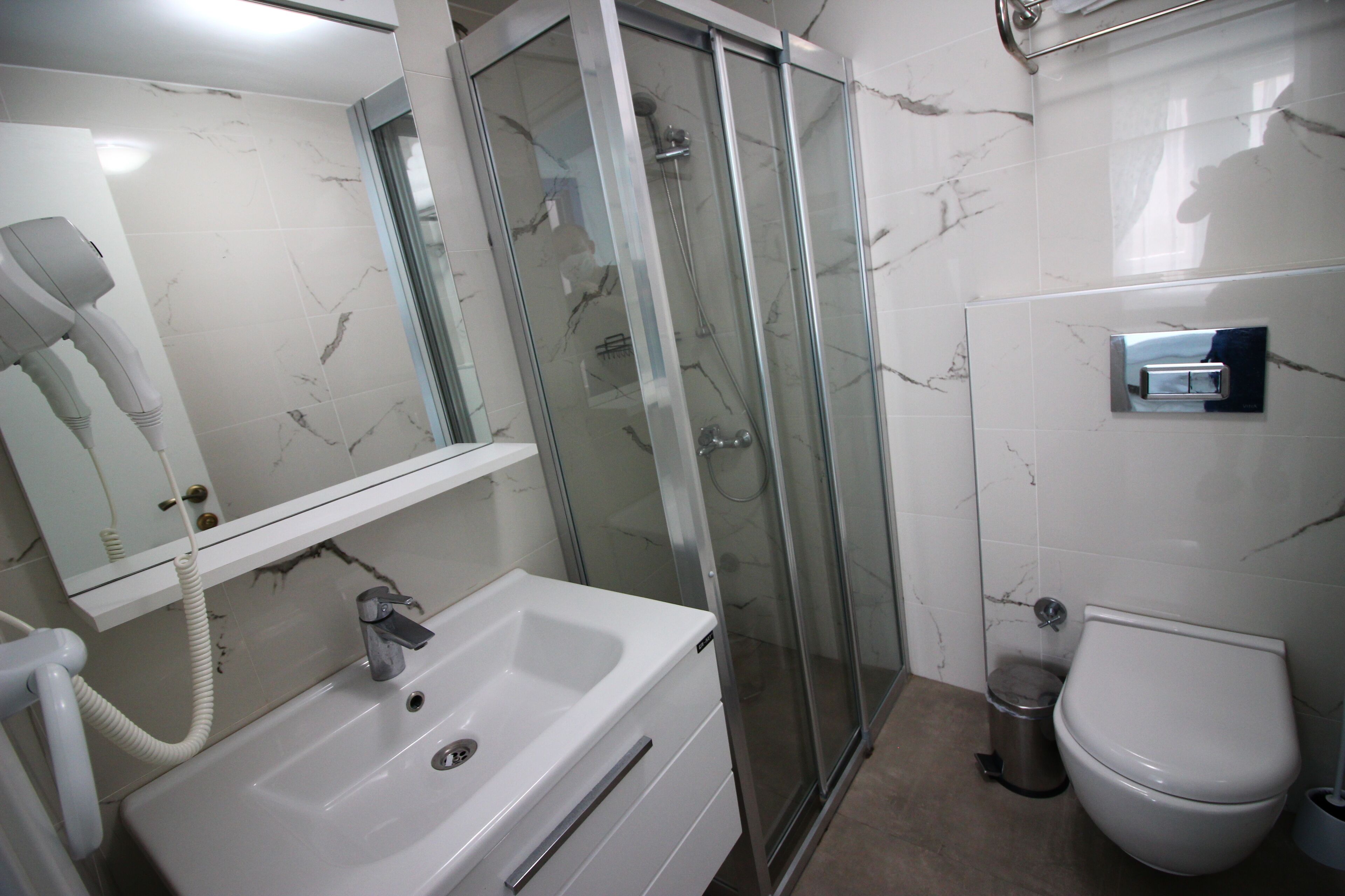 standard double room | bathroom | shower, hair dryer, towels, soap