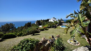 A coastal property with a swimming pool, lush greenery, and a view of the ocean. - Andalusian style villa with stunning views. PAX 6. FREE WIFI (Tarifa)
