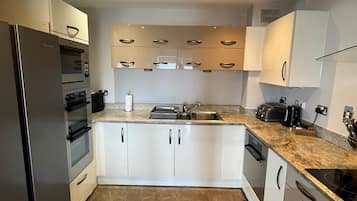 Two Bedroom Duplex | Private kitchen | Electric kettle, toaster, cookware/dishes/utensils