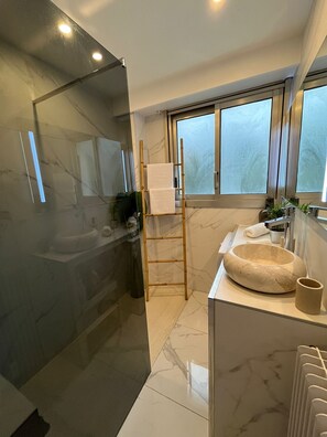 Shower, hair dryer, towels, soap