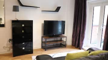 Studio Apartment with Balcony | Living area | TV