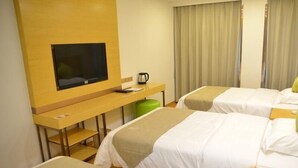 A hotel room with two beds, a TV, a desk with a coffee maker, and a remote control on a nightstand. - Greentree Inn Suzhou Changshu Huanghe Road Linli C (Suzhou)