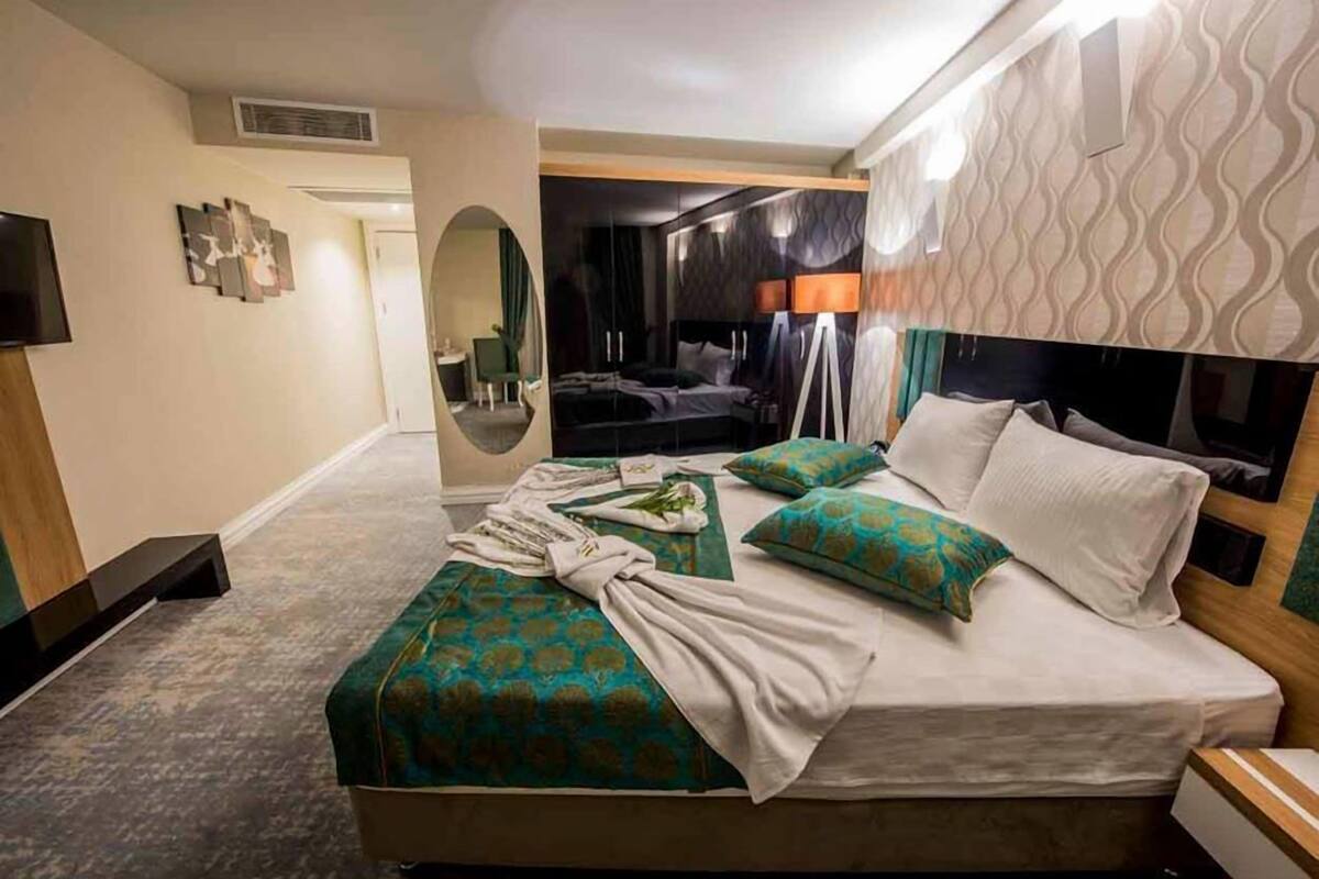 Premium bedding, down comforters, free minibar items, in-room safe