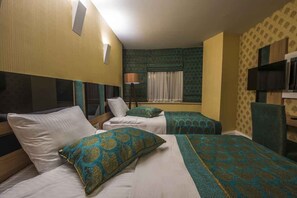 Premium bedding, down comforters, free minibar items, in-room safe