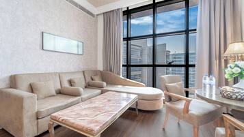 Executive Suite | Living area | 40-inch LCD TV with satellite channels, TV