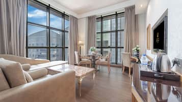 Executive Suite | Living area | 40-inch LCD TV with satellite channels, TV