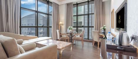 Executive Suite | Living area | 40-inch LCD TV with satellite channels, TV