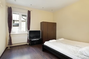 Apartamento, 2 quartos | 2 quartos, ferros/tábuas de passar roupa, Wi-Fi de cortesia