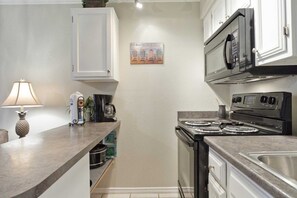 Fridge, microwave, stovetop, coffee/tea maker