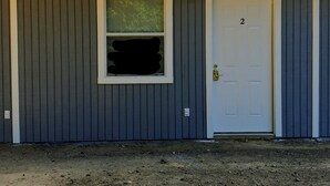 A building with a white door marked with the number 2, a window with a green screen, and a metal roof. - Apartment 2- 2760 Carters Ferry Road Milam Texas.        Free Ice !!!  (Milam)
