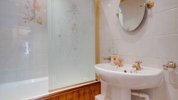 Bathtub, hair dryer, towels, soap
