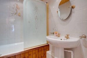 Bathtub, hair dryer, towels, soap