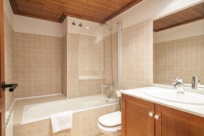 Bathtub, hair dryer, towels