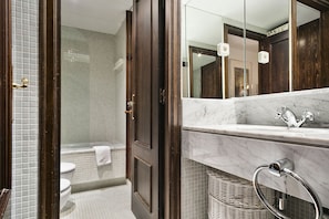 Bathtub, hair dryer, towels, soap