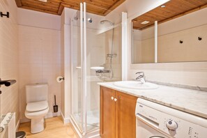 Bathtub, hair dryer, towels, soap