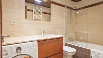 Bathtub, hair dryer, towels, soap