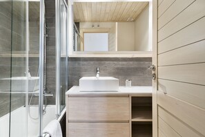 Bathtub, hair dryer, towels, soap