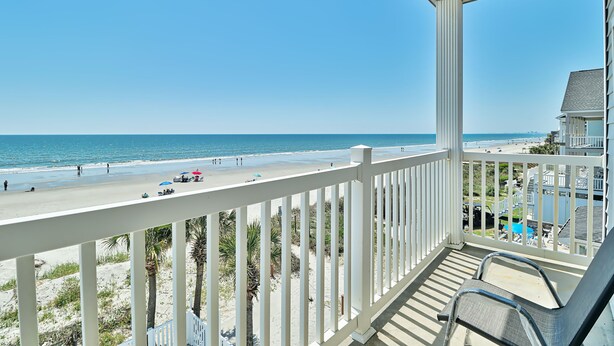 A balcony with a view of the beach and ocean. - PierWatch I 101 | Oceanfront Six Bedroom Condo (North Myrtle Beach)