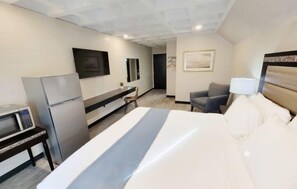 Singola Deluxe, frigorifero e microonde | Area soggiorno | Smart TV