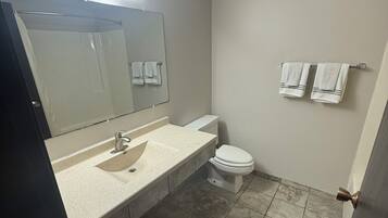 Combined shower/bathtub, towels, soap, shampoo