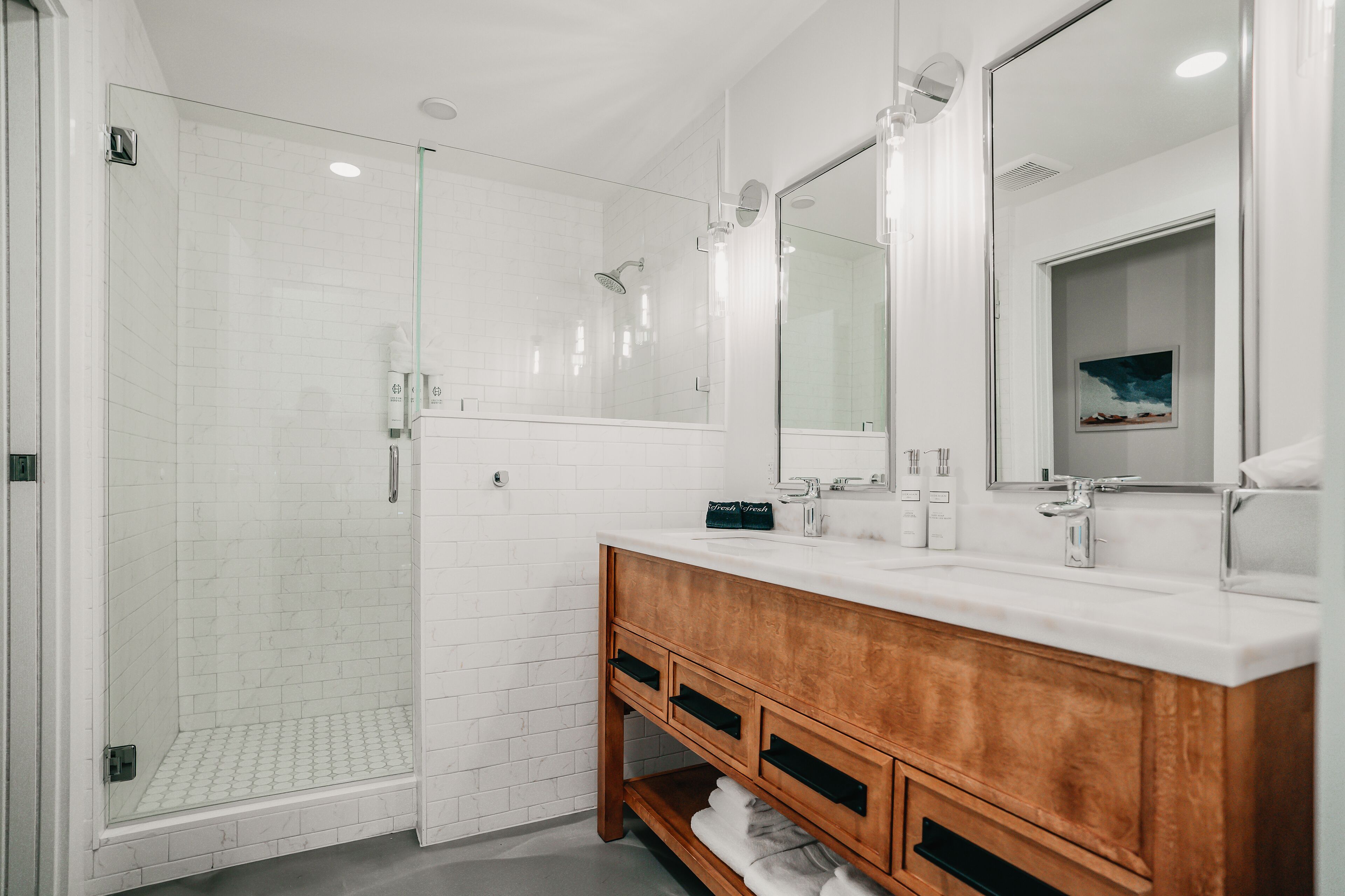 designer toiletries, hair dryer, towels, soap