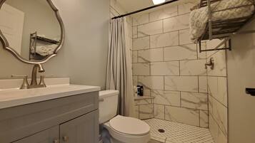 Combined shower/tub, hair dryer, towels, soap