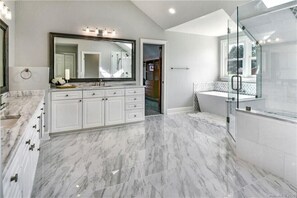 Combined shower/tub, hair dryer, towels, soap