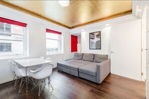 Apartment, 2 Bedrooms | Living area | Flat-screen TV, heated floors