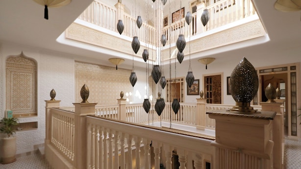 A multi-level interior with ornate railings, hanging lanterns, and traditional decor. - Riad Mareme & Spa (Marrakech)