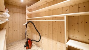 A room with wooden walls, a bunk bed, and a vacuum cleaner. - Apartment Zugspitze with Terrace, Mountain view & Wi-Fi (Grainau)